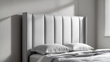 Ellie winged upholstered headboard in neutral fabric showing elegant vertical panel design