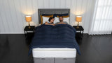 A couple sleeping on their hybrid pillow top mattress