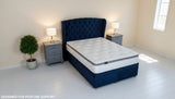 Orthopaedic white pocket spring mattress in a bedroom setting.