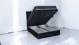 ELIZA black upholstered ottoman storage bed front view with mattress, showing spacious storage compartments